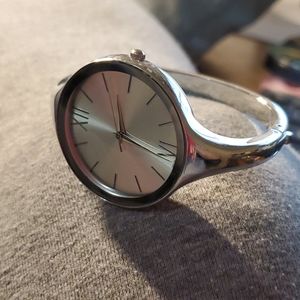Silvertone bangle hinge closure watch